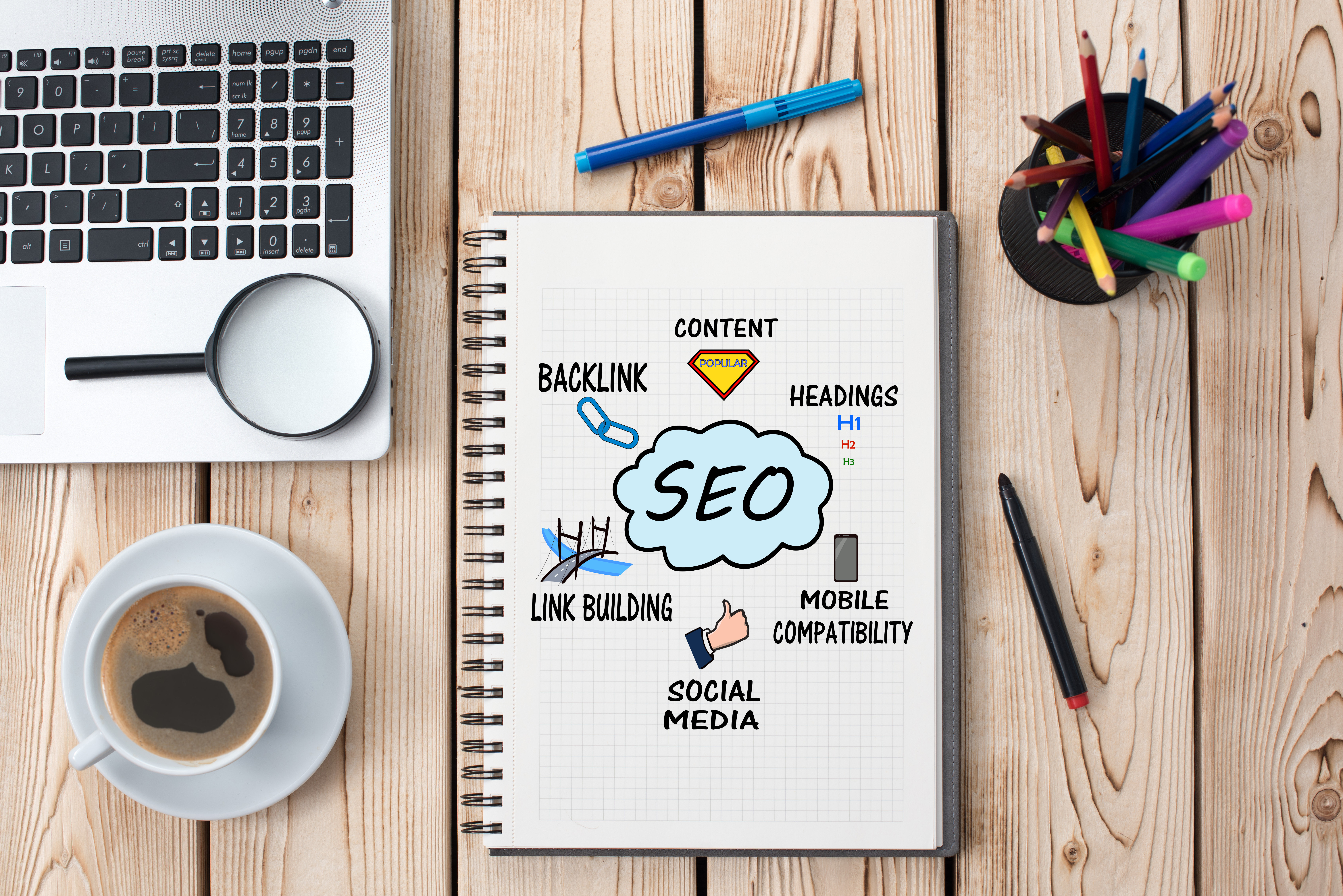 open notebook with SEO keywords written all across the page